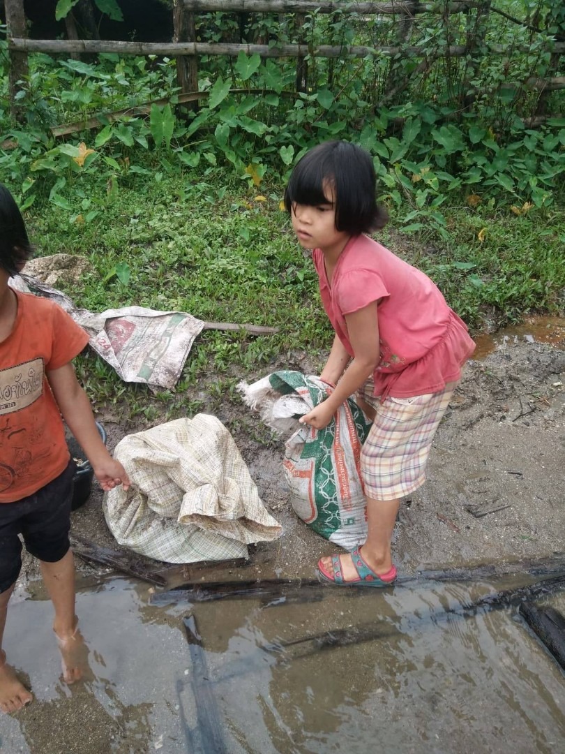 Everyone works. 7-year-old helping with construction